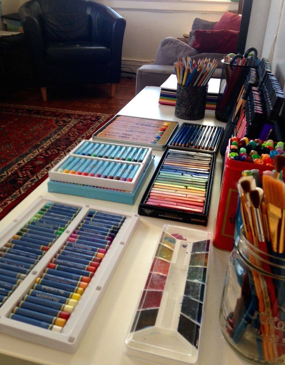 Art supplies laid out on a table in the therapy office
